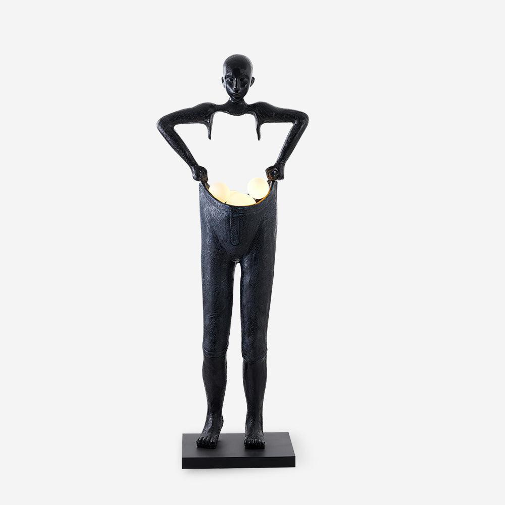 تمثال رجل يحمل سروالاً مصباح أرضي